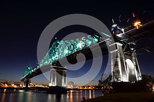 Montreal 375th anniversary. Jacques Cartier Bridge. Bridge panoramic colorful silhouette by night